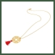 sautoir collier disque arabesque plaqué or pompon corail